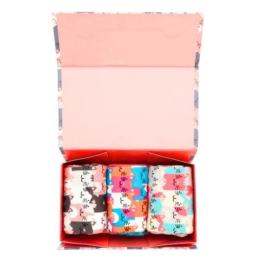 An opened box showing 3 pairs of bamboo socks inside. Each pair has a cat design in different colours - one pair is pinks and grey, one is ponk, orange, blue and whilte and one is pale blue, pink, white and pale grey