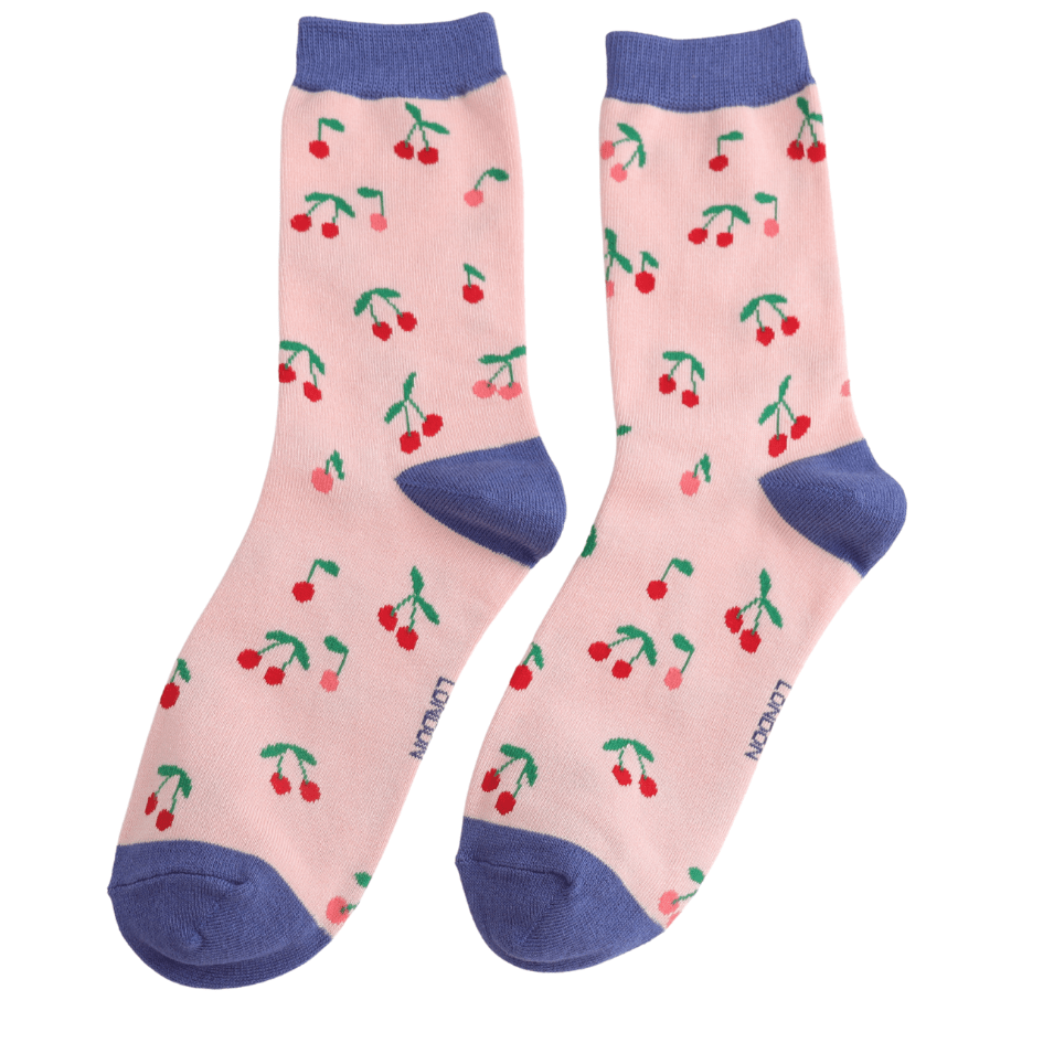 A pair of pink socks with blue cuffs, heels and toes and a repeated cherry print all over them. 