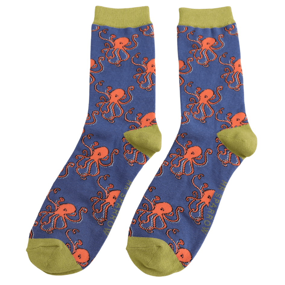 A pair of blue socks with green cuffs, heels and toes, and a repeated orange octopus design