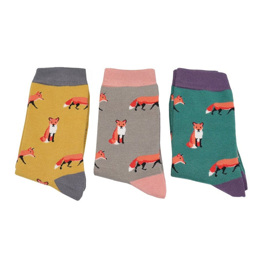 Three pairs of socks with fox patterns on a white background