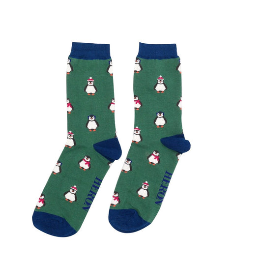 One pair of Mr Heron bamboo socks.  They are green with blue trim, and have penguins on. 