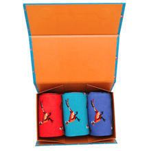 Load image into Gallery viewer, Three pairs of bamboo socks with pheasant design in a box with orange interior. The socks are individually coloured red, light blue and royal blue