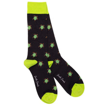 Load image into Gallery viewer, A pair of crew socks with a black background featuring a repeating pattern of green sea turtles with brown shells. The socks have bright neon yellow-green cuffs, heels, and toes, with the words Swole Panda printed in white script near the toes.