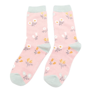 pair of pink bamboo socks with dainty floral design and pale green trim 