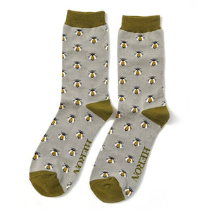 pair of Mr Heron mens bamboo socks with honey bee design. The socks are grey with a green trim. 