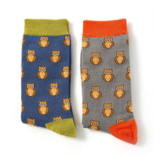 Load image into Gallery viewer, two pairs of mens Mr Heron bamboo socks, one get with orange trim, and one blue with green trim, both with a repeated owl design on them